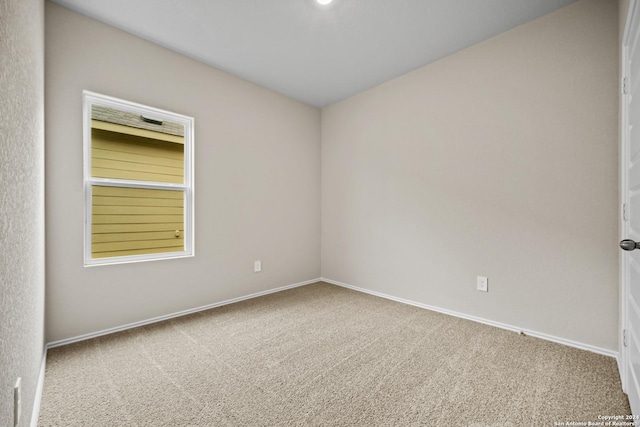 spare room featuring carpet floors