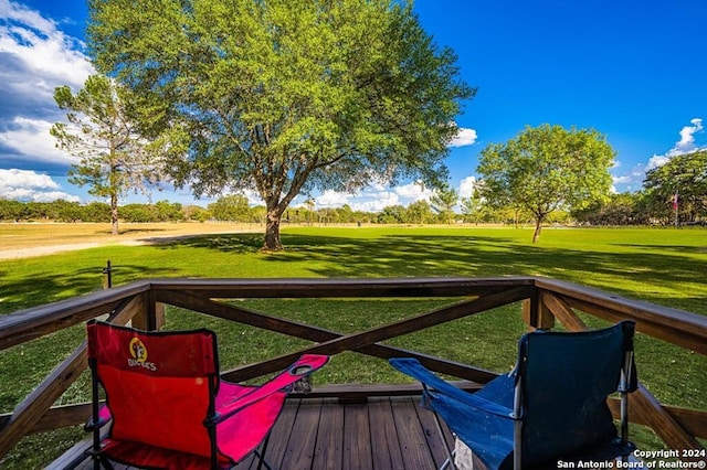 deck featuring a lawn