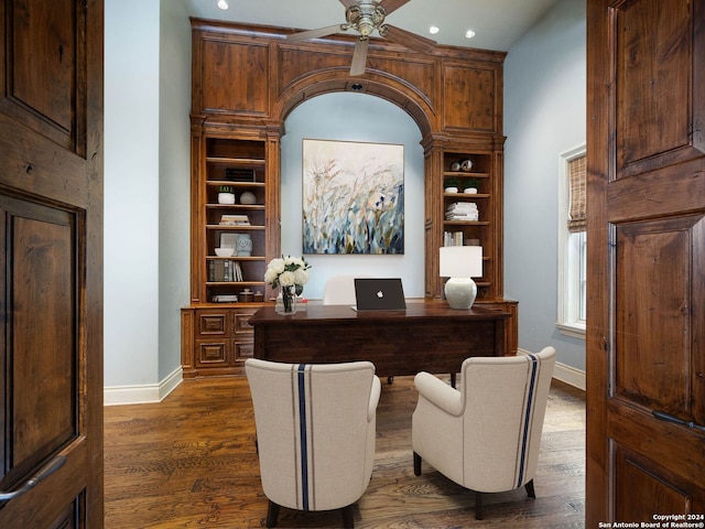 office area with ceiling fan and dark hardwood / wood-style floors