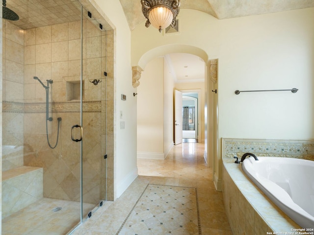 bathroom featuring tile patterned floors and shower with separate bathtub