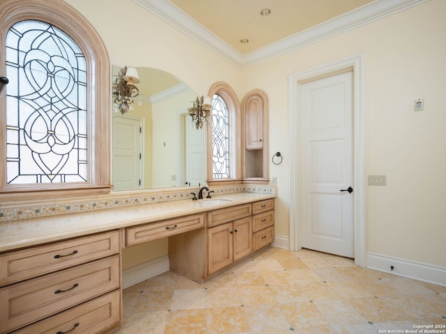 bathroom with vanity and ornamental molding