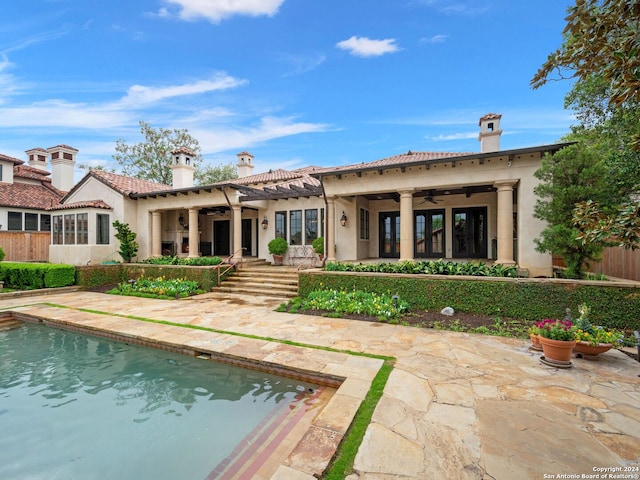 back of property featuring a patio and ceiling fan