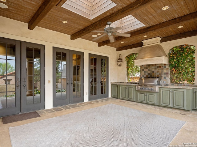 view of patio with ceiling fan, area for grilling, and french doors