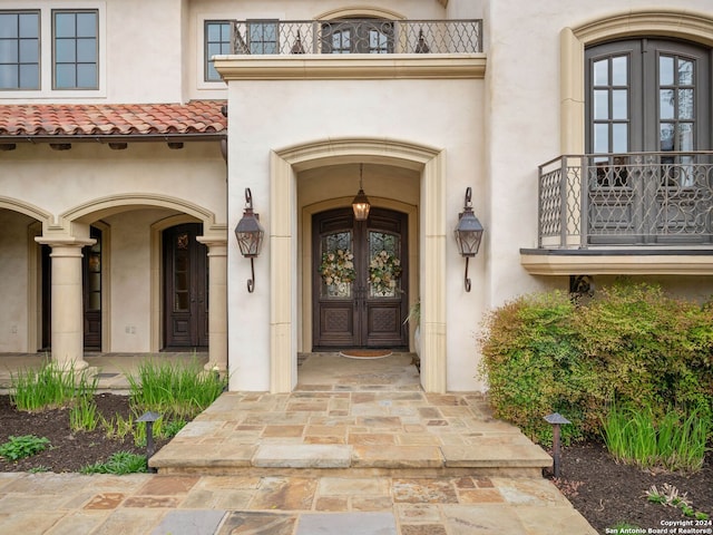 doorway to property featuring french doors and a balcony