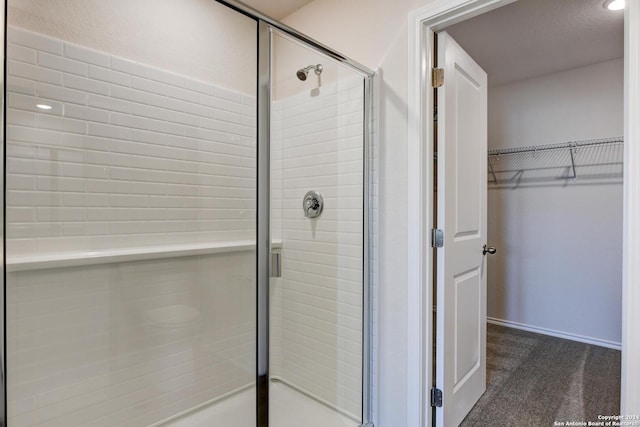 bathroom featuring an enclosed shower