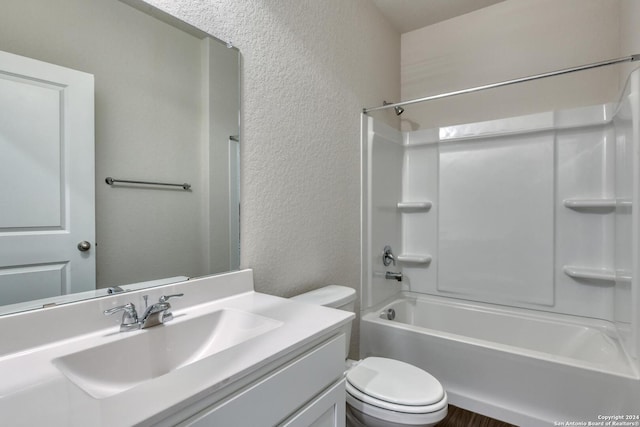 full bathroom with vanity, toilet, and washtub / shower combination