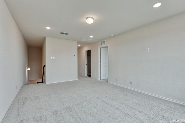 empty room featuring light carpet