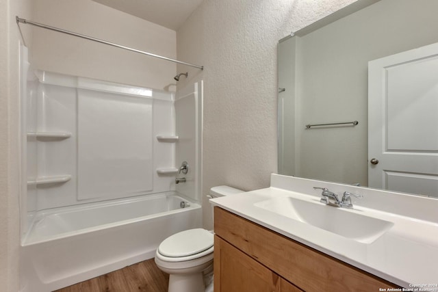 full bathroom featuring wood-type flooring, vanity, toilet, and tub / shower combination