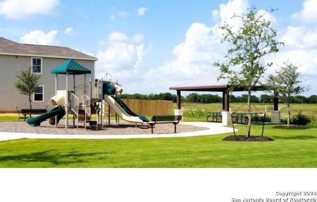 view of playground with a lawn and a gazebo