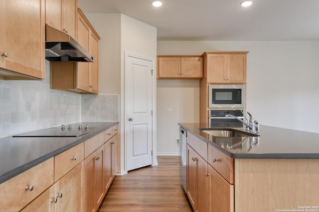 kitchen featuring built in microwave, sink, dishwasher, light hardwood / wood-style floors, and black electric stovetop