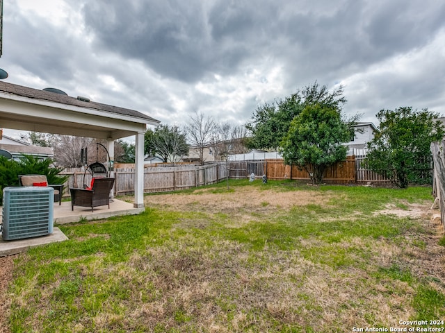 view of yard featuring a patio area and cooling unit