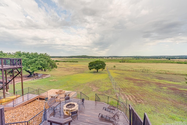 deck featuring a rural view and a hot tub