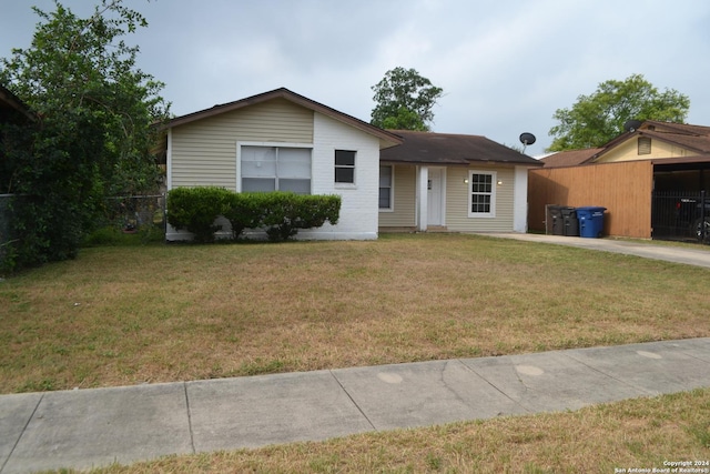 ranch-style home with a front lawn