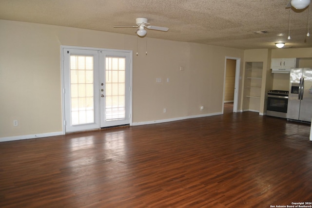 unfurnished living room featuring ceiling fan, french doors, dark wood-type flooring, and a textured ceiling