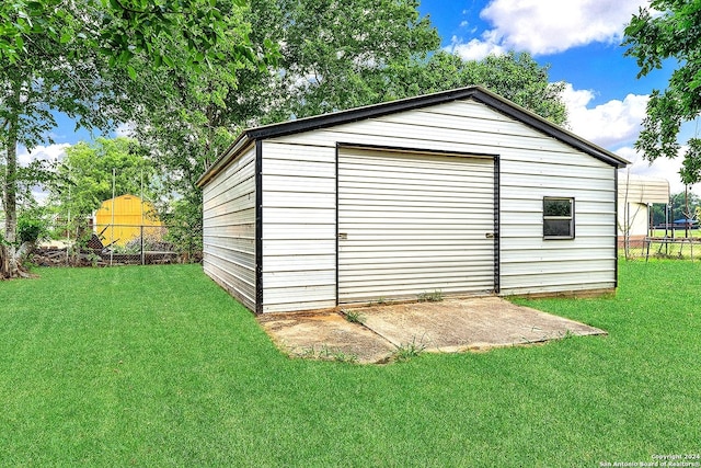 view of outbuilding with a lawn