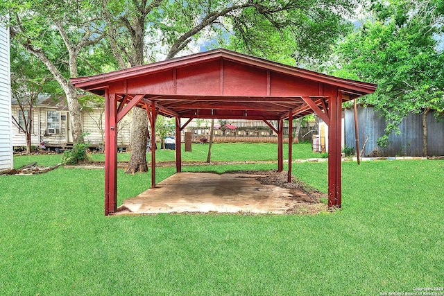 view of home's community with a lawn and a storage unit