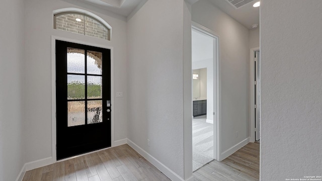 foyer with light wood-type flooring