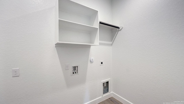 washroom with gas dryer hookup, hookup for a washing machine, wood-type flooring, and hookup for an electric dryer