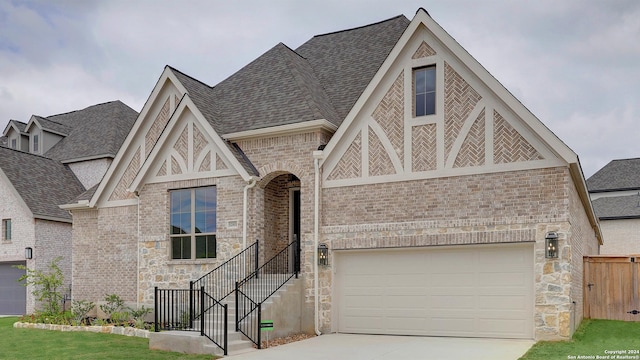 english style home with a garage