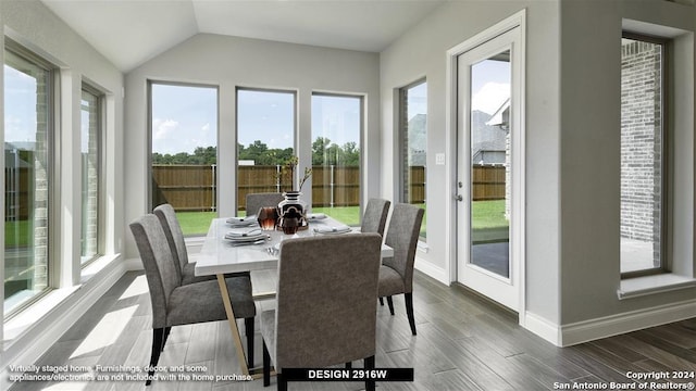 sunroom / solarium featuring vaulted ceiling and a wealth of natural light