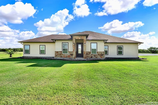 7803 US Highway 181, Falls City, TX 78113 - rear view of property featuring stucco siding, stone siding, and a lawn