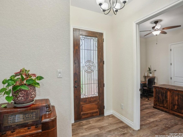 7803 US Highway 181, Falls City, TX 78113 - foyer featuring wood finished floors, a chandelier, baseboards, and ceiling fan