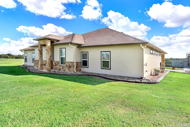 7803 US Highway 181, Falls City, TX 78113 - back of house with stucco siding, stone siding, a yard, and a shingled roof