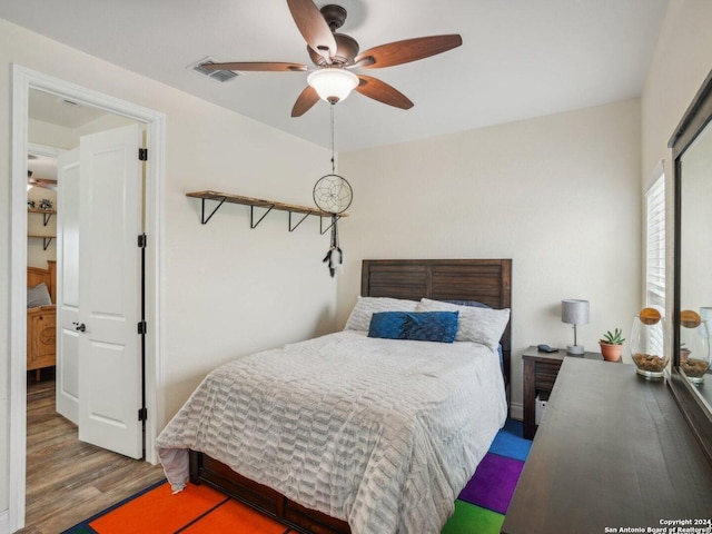7803 US Highway 181, Falls City, TX 78113 - bedroom featuring wood finished floors and ceiling fan