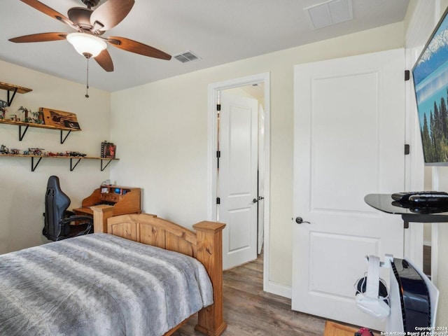 7803 US Highway 181, Falls City, TX 78113 - bedroom with wood finished floors and a ceiling fan