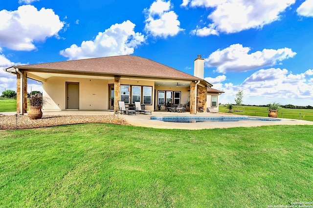 7803 US Highway 181, Falls City, TX 78113 - rear view of property featuring a chimney, a yard, and stucco siding