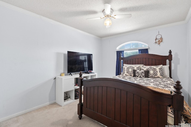 bedroom featuring light carpet, a textured ceiling, and ceiling fan