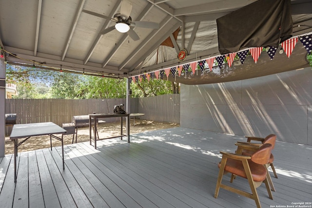 wooden deck with a gazebo and ceiling fan