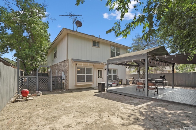 rear view of property with a deck