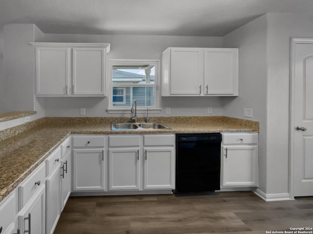 kitchen with dark hardwood / wood-style flooring, black dishwasher, white cabinetry, and sink