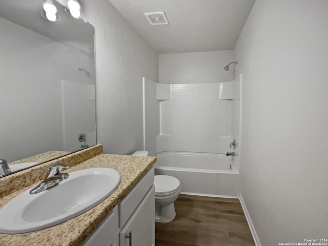 full bathroom featuring vanity, wood-type flooring, tub / shower combination, and toilet