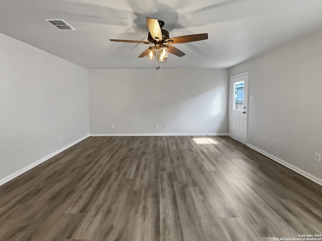 unfurnished room featuring dark hardwood / wood-style floors and ceiling fan