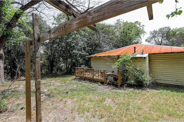 view of yard with a wooden deck