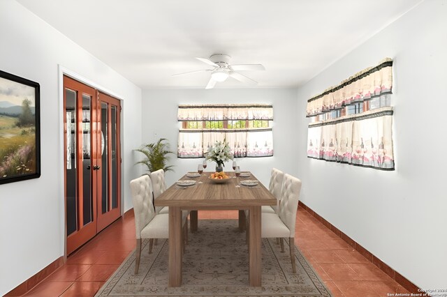 dining area with tile floors and ceiling fan