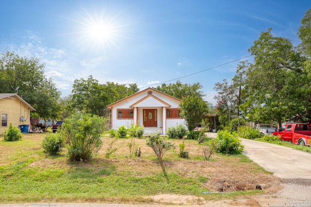 bungalow-style home with driveway