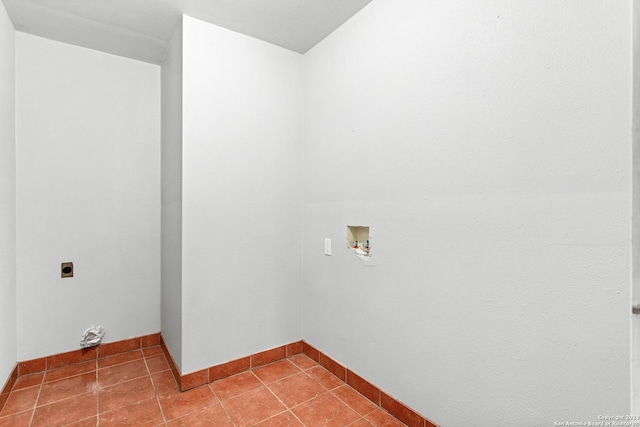 laundry area featuring laundry area, hookup for a washing machine, hookup for an electric dryer, and tile patterned floors