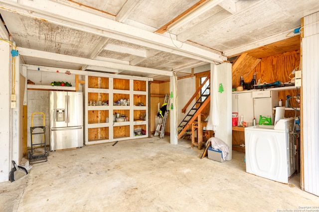 garage with washer / dryer and stainless steel fridge