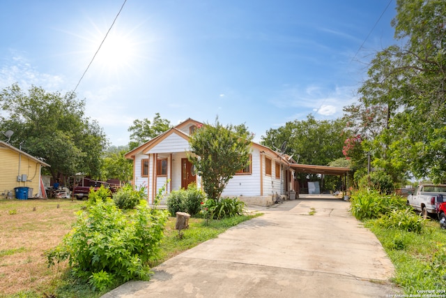 bungalow-style house featuring a carport