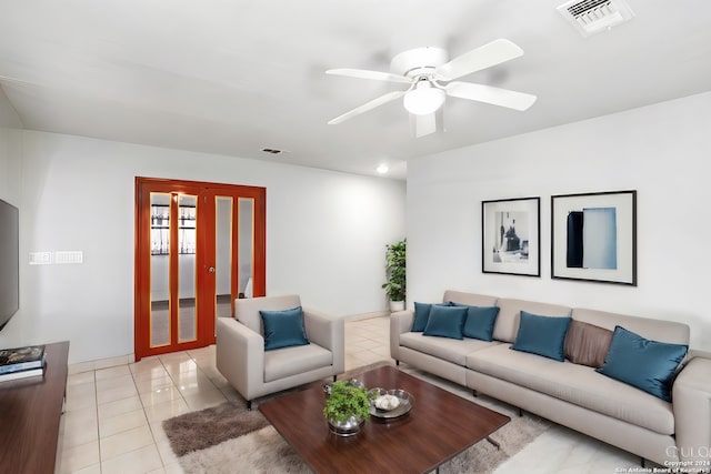 living room featuring french doors, ceiling fan, and light tile flooring