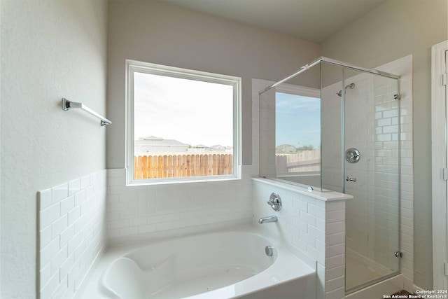 bathroom featuring plus walk in shower