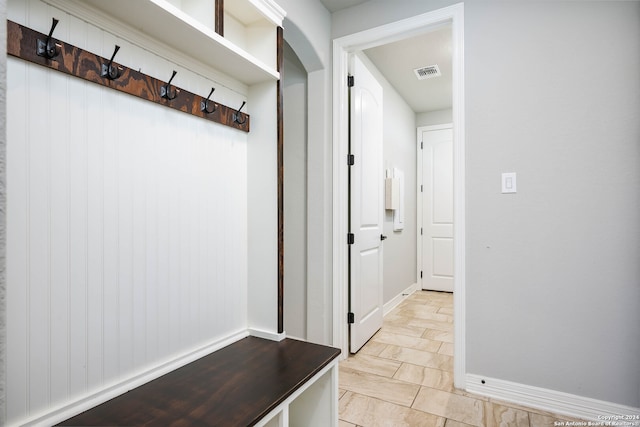 mudroom with light tile floors