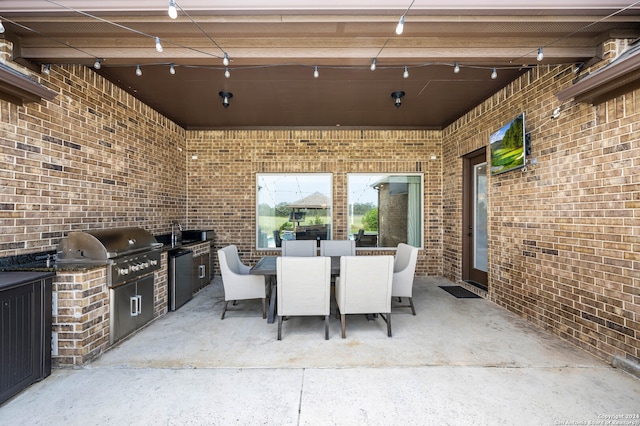 view of patio with exterior kitchen and area for grilling