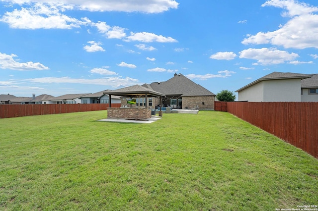 back of property featuring a patio area and a lawn