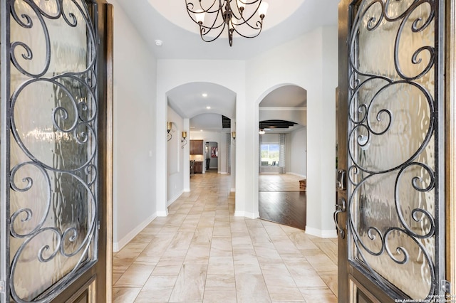 foyer featuring a notable chandelier