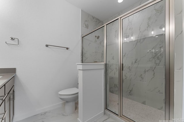 bathroom with vanity, toilet, and an enclosed shower