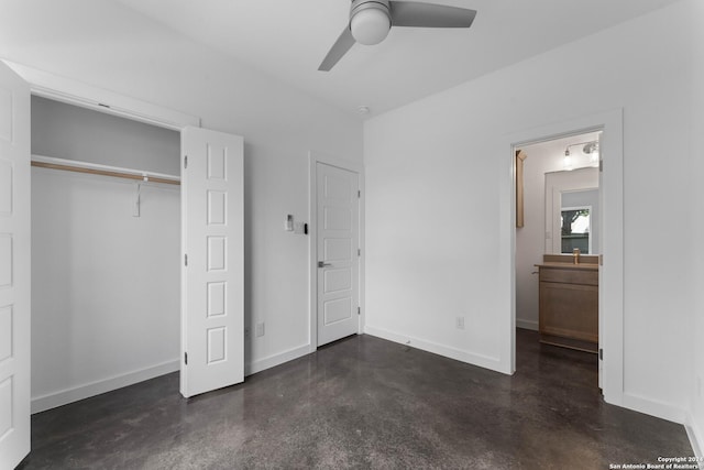 unfurnished bedroom with ceiling fan, connected bathroom, and a closet